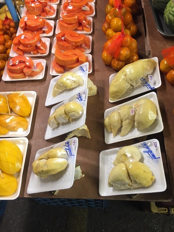 Durian and other fruits packaged for sale at the market